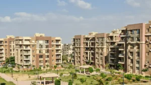 Résidence étudiante moderne Fac Habitat avec immeubles collectifs et espaces verts, illustration d’un logement étudiant sans frais en 2026.